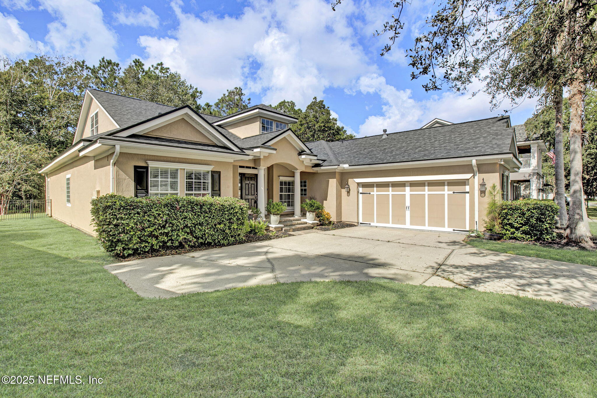 1961 Glenfield Crossing Court St. Augustine, FL 32092 - Photo 2 of 40 a front view of a house with a garden
