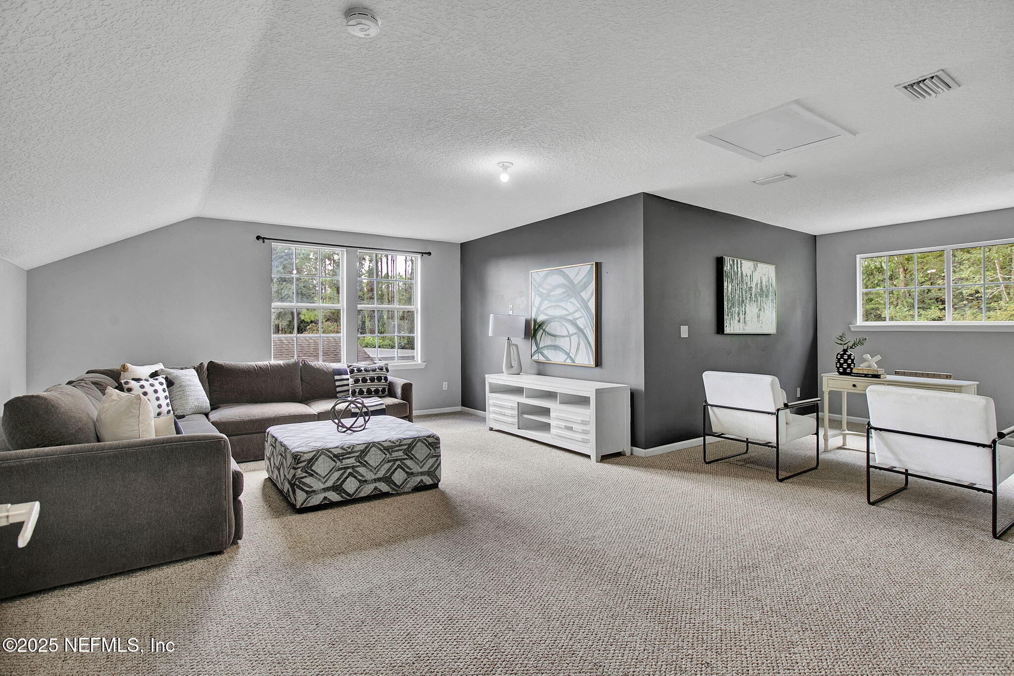 1961 Glenfield Crossing Court St. Augustine, FL 32092 - Photo 22 of 40 a living room with furniture and a large window