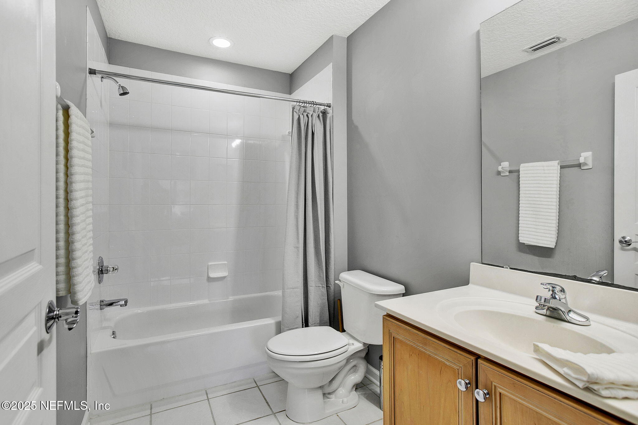1961 Glenfield Crossing Court St. Augustine, FL 32092 - Photo 35 of 40 a bathroom with a sink toilet and shower