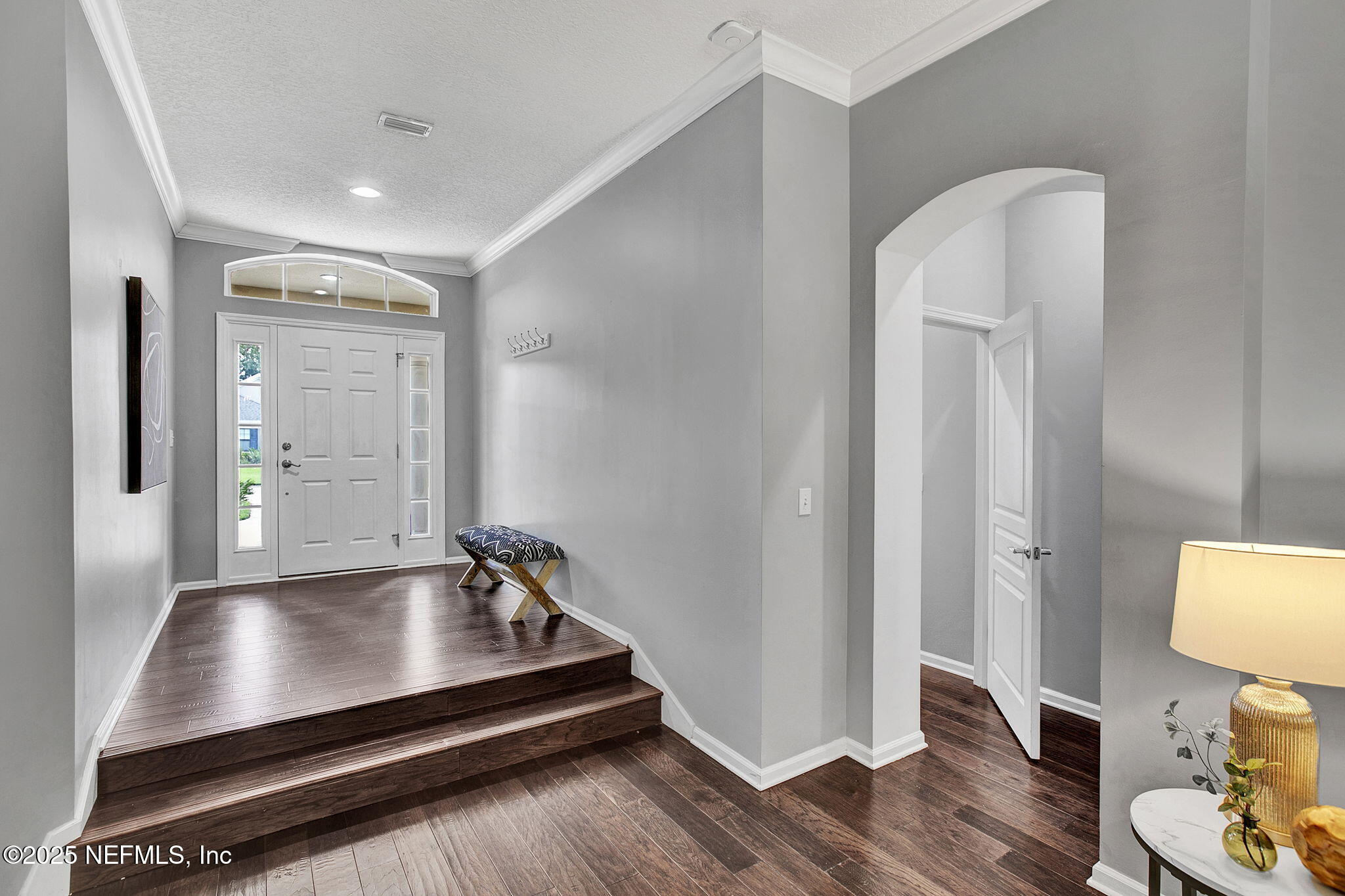 1961 Glenfield Crossing Court St. Augustine, FL 32092 - Photo 4 of 40 a room with wooden floor and furniture