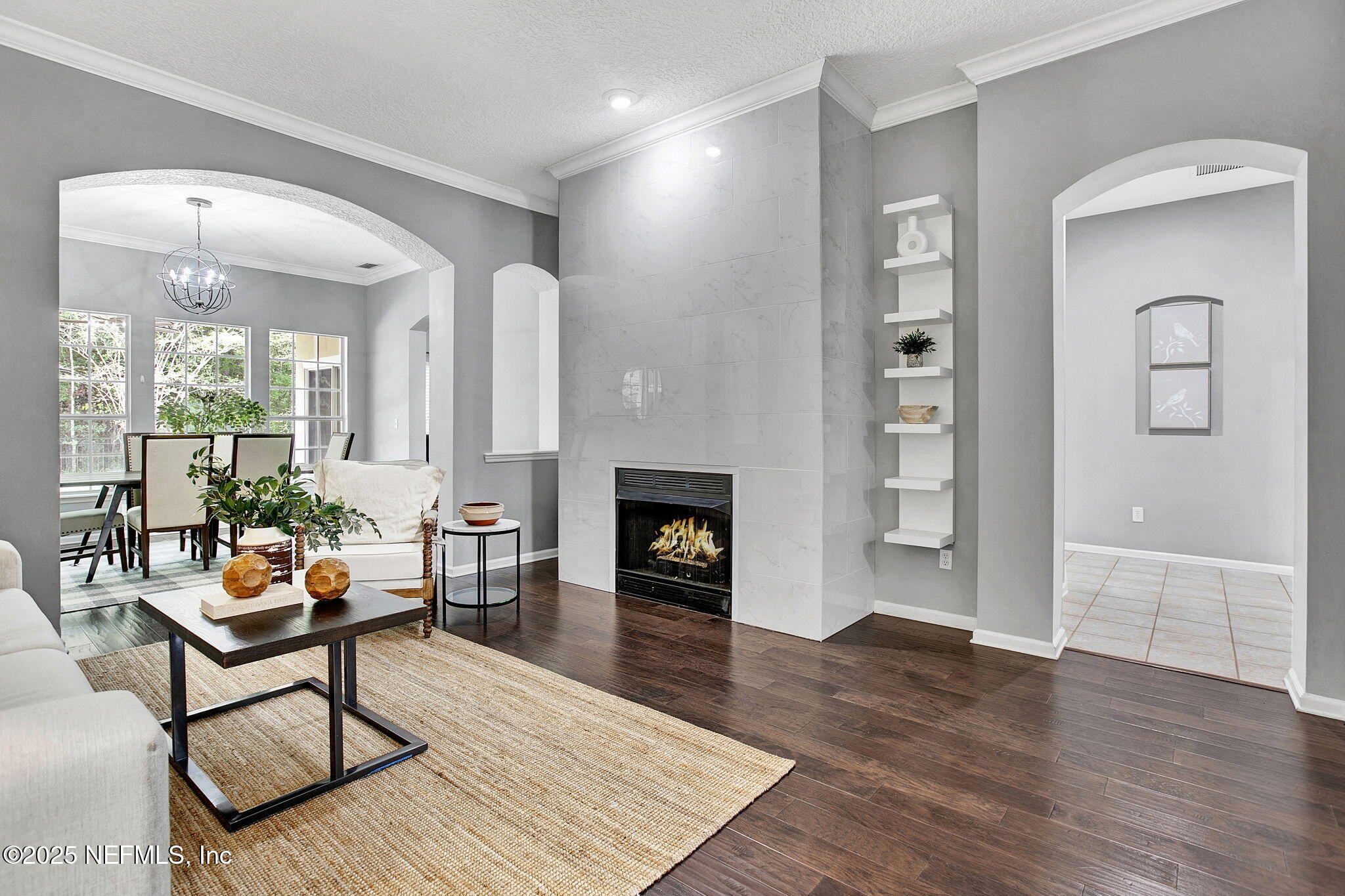 1961 Glenfield Crossing Court St. Augustine, FL 32092 - Photo 5 of 40 a living room with furniture and a fireplace