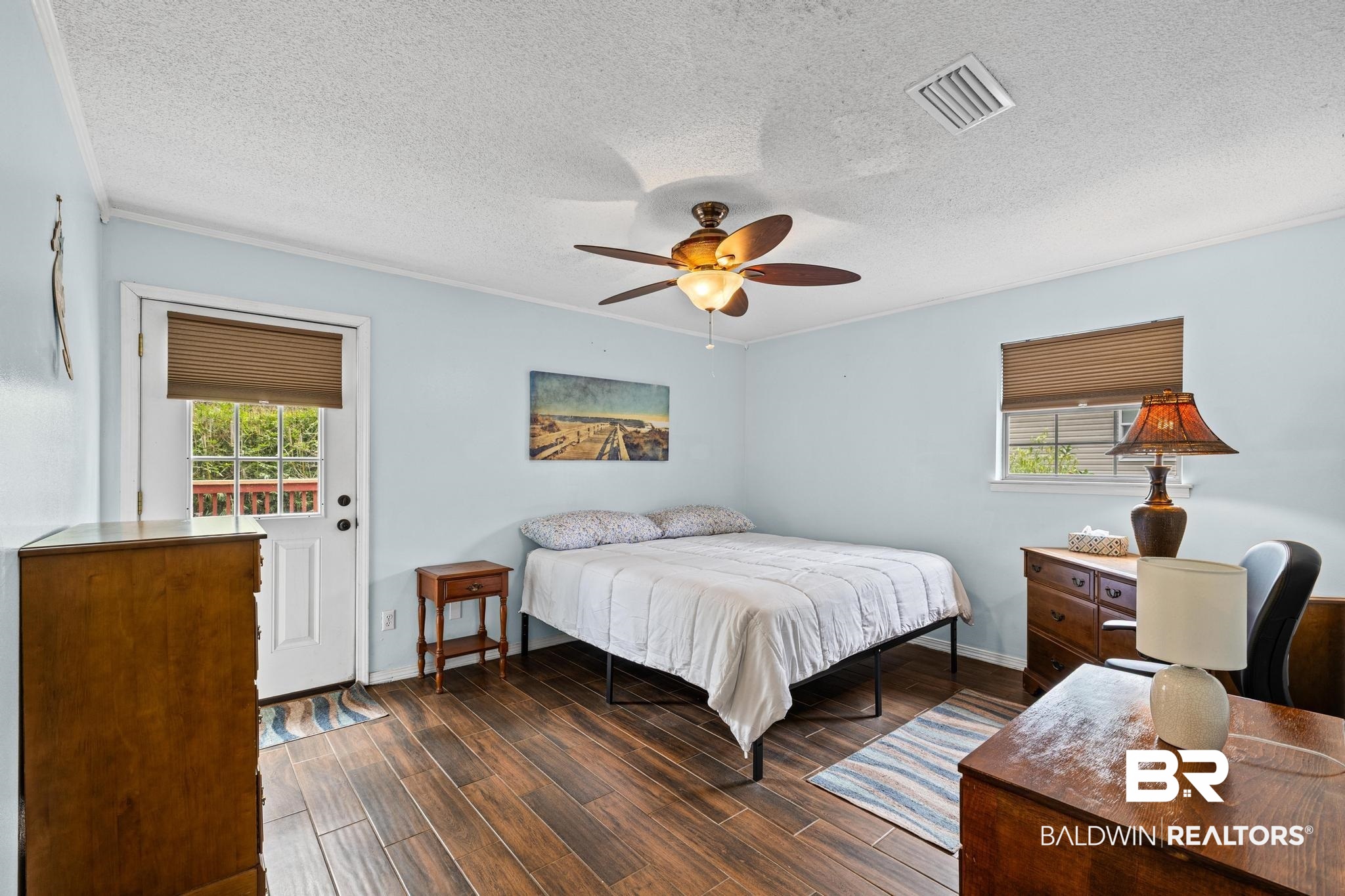 1437 Rio Circle Lillian, AL 36549 - Photo 15 of 46 Bedroom with dark wood finished floors, a textured ceiling, and a ceiling fan