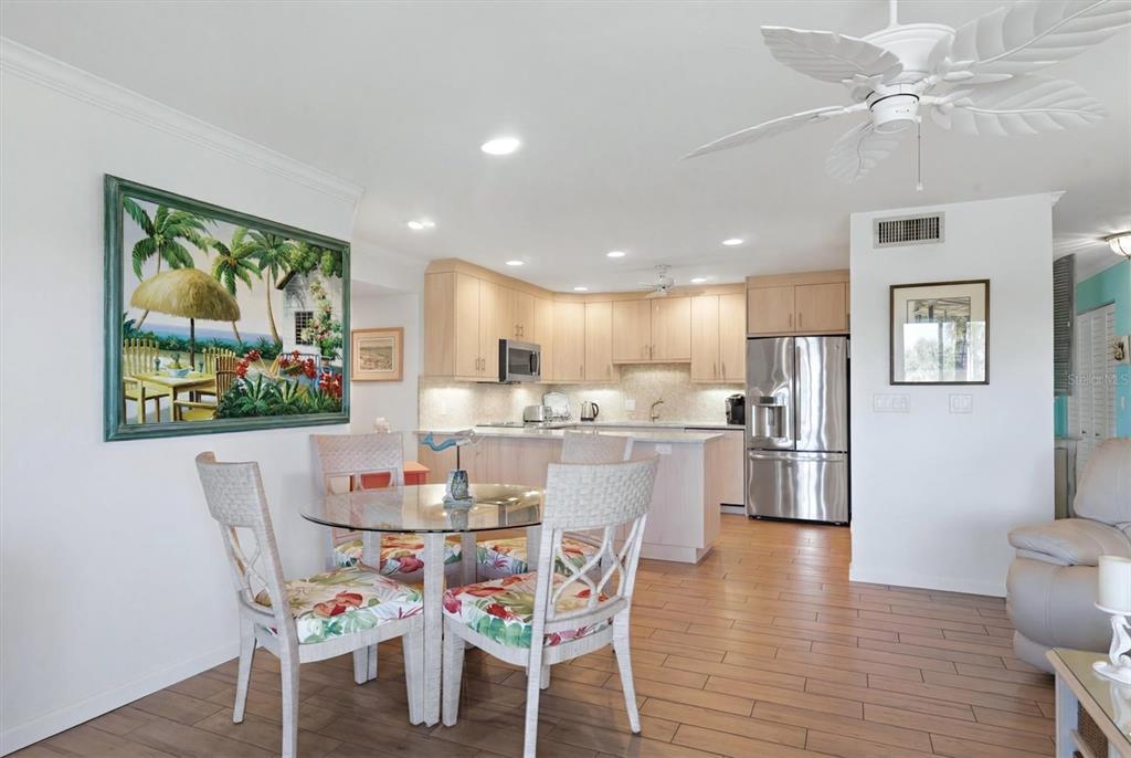 2729 North Beach Road, Unit 211 Englewood, FL 34223 - Photo 17 of 51 a dining room with furniture and window