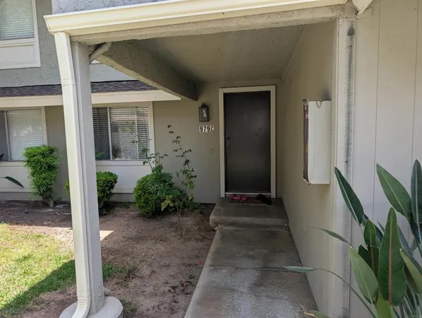 a view of potted plants in front of door