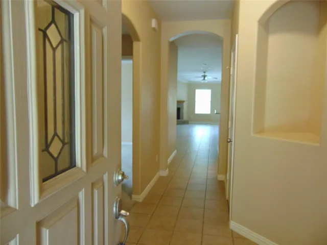 a view of a bathroom from a hallway