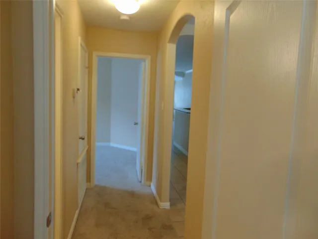 a view of a bathroom from a hallway