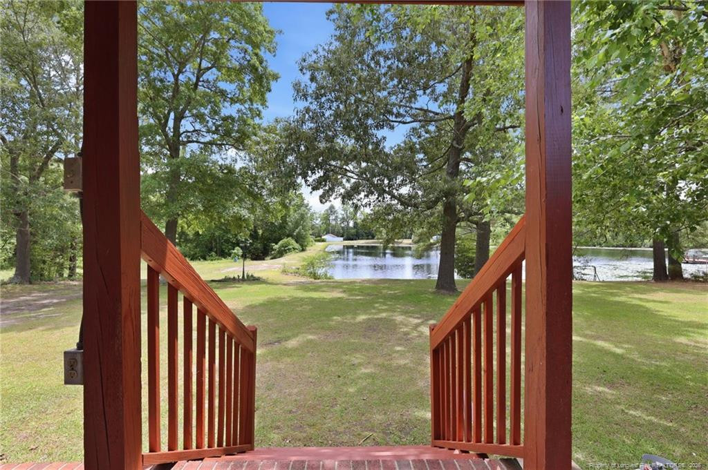 10400 Ruth Vinson Road Autryville, NC 28318 - Photo 21 of 49 a view of a balcony with an outdoor space