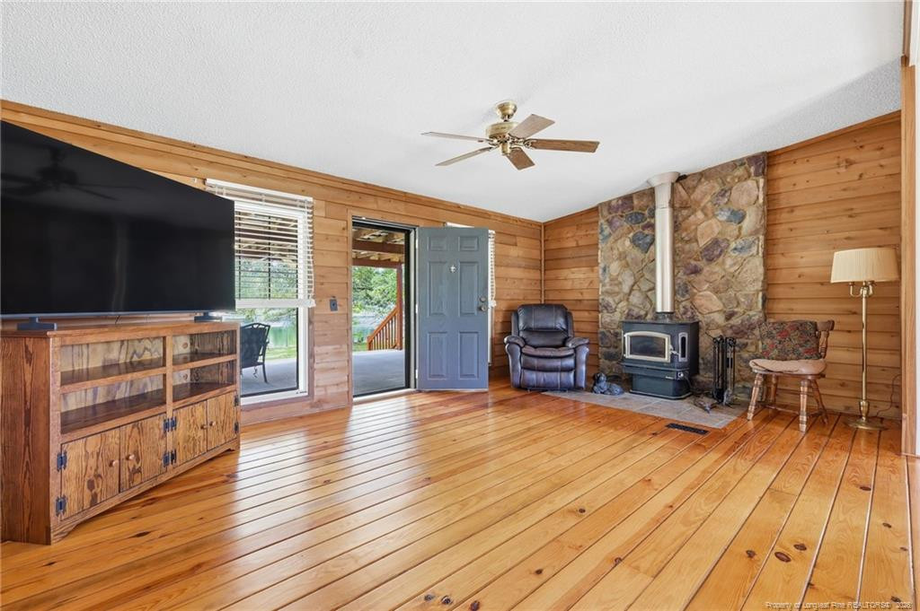 10400 Ruth Vinson Road Autryville, NC 28318 - Photo 22 of 49 a living room with furniture and a flat screen tv