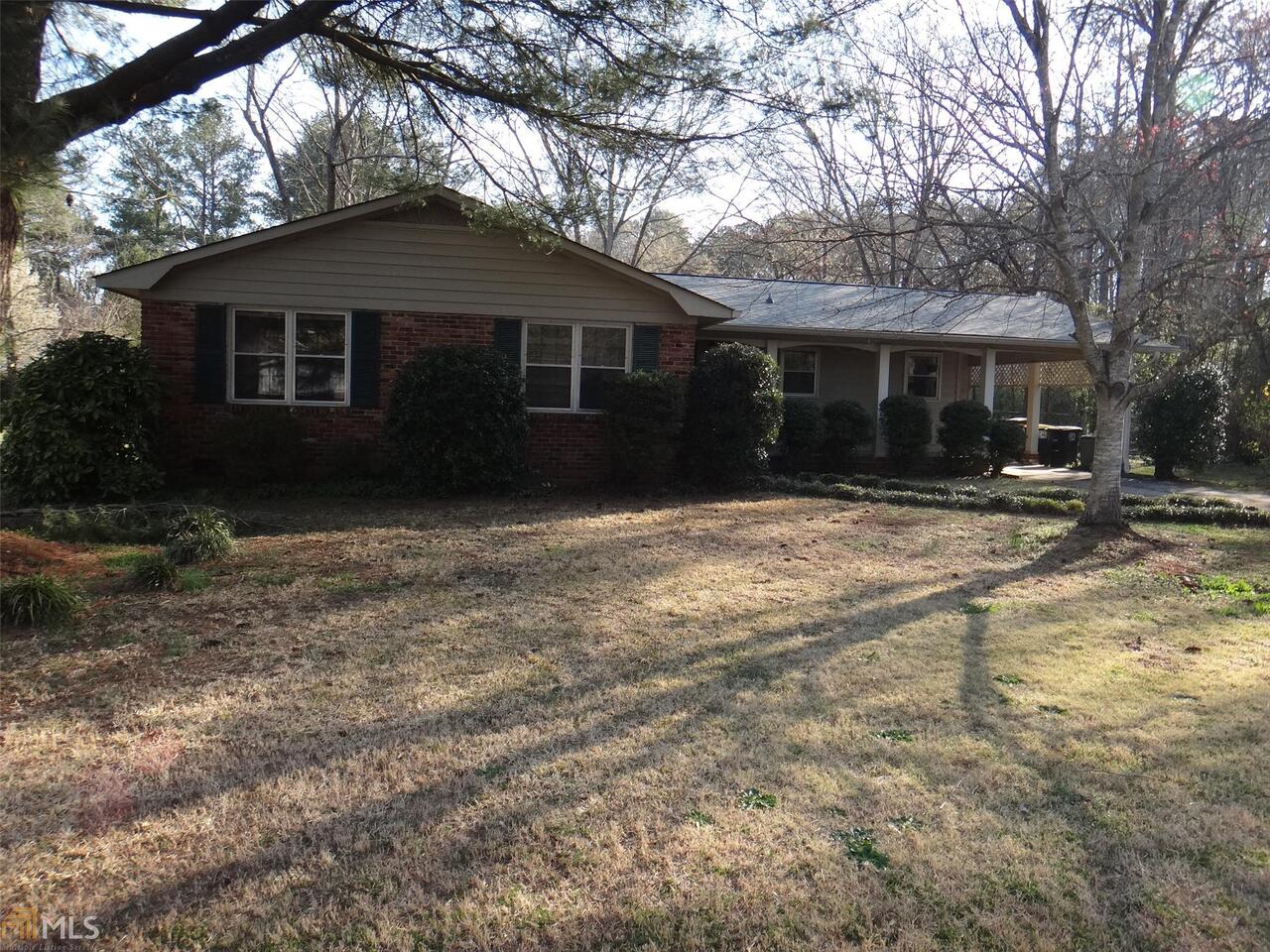 3 Bray Road Southeast, Unit 10 Rome, GA 30161 - Photo 1 of 1 a front view of a house with a yard