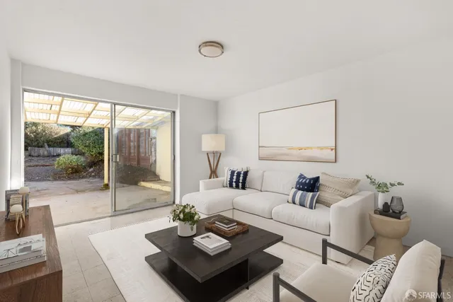 a view of an empty room with glass door