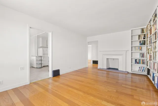 a bedroom with a bed and a fireplace