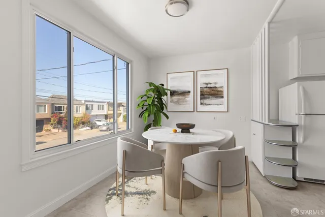 a dining room with furniture and window