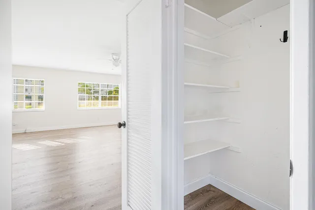 a view of an empty room with a window
