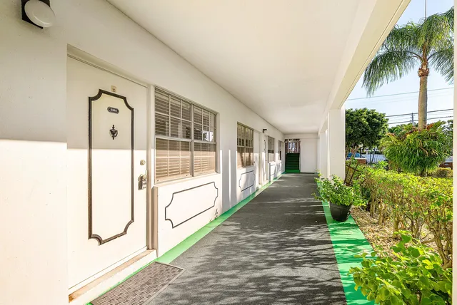 an aerial view of a house a table and chairs