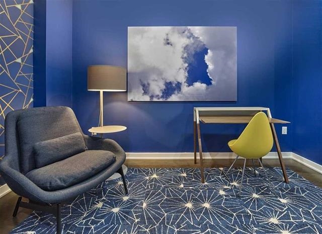 250 Ave East, Unit 609 Bayonne, NJ 07002 - Photo 14 of 17 a living room with a couch and a lamp