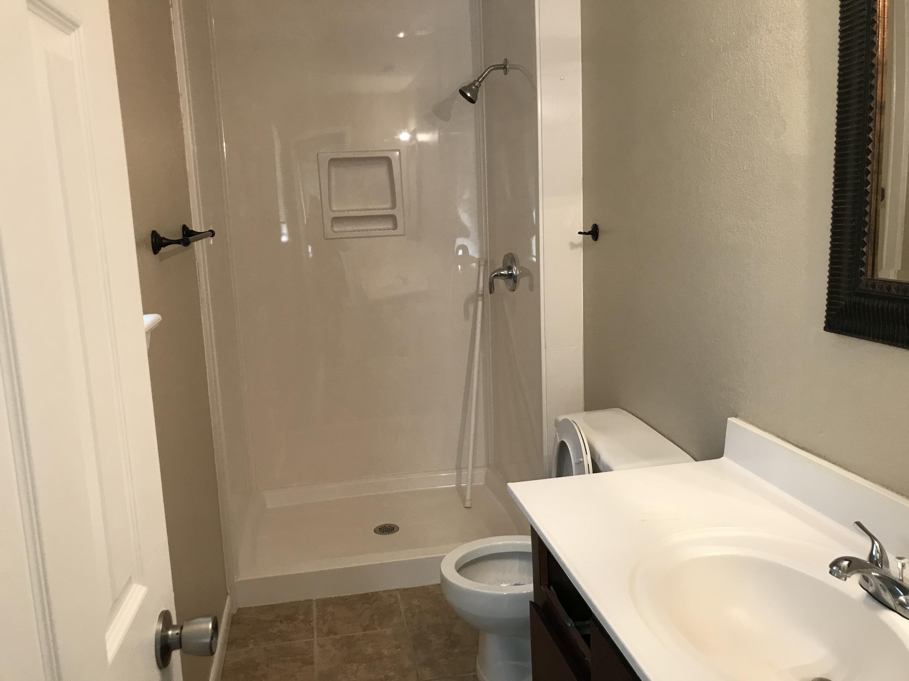 5438 Highway 4 Baker, FL 32531 - Photo 11 of 11 a bathroom with a sink toilet and shower