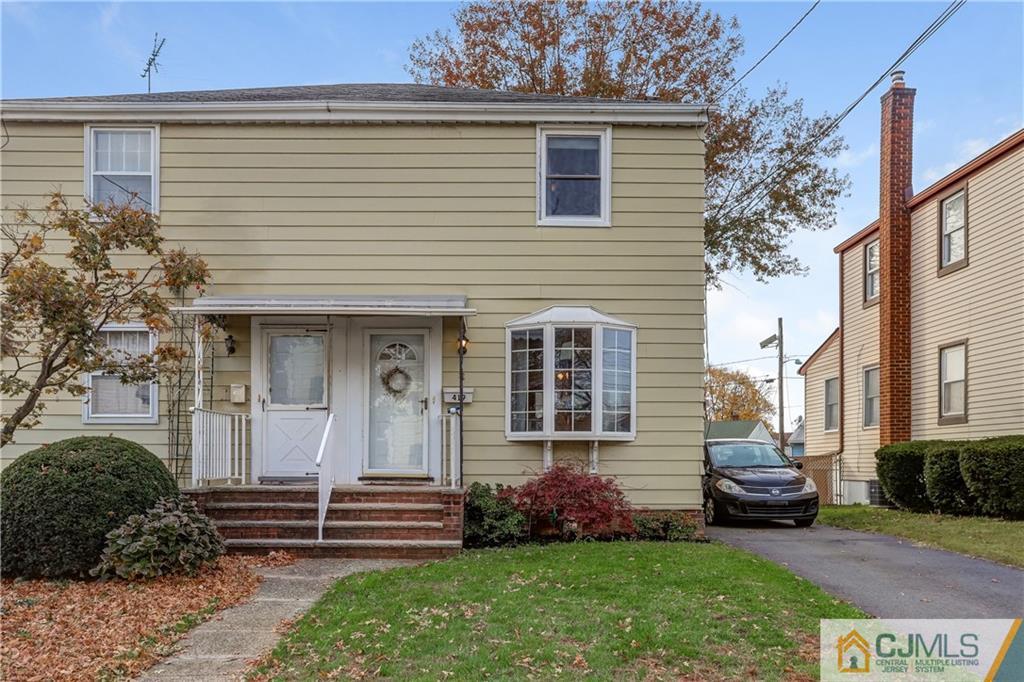 419 Crows Mill Road Fords, NJ 08863 - Photo 1 of 10 a front view of a house with a garden