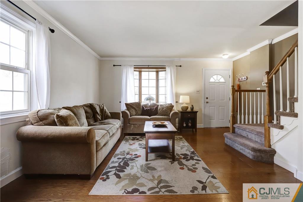 419 Crows Mill Road Fords, NJ 08863 - Photo 2 of 10 a living room with furniture or couch and a window