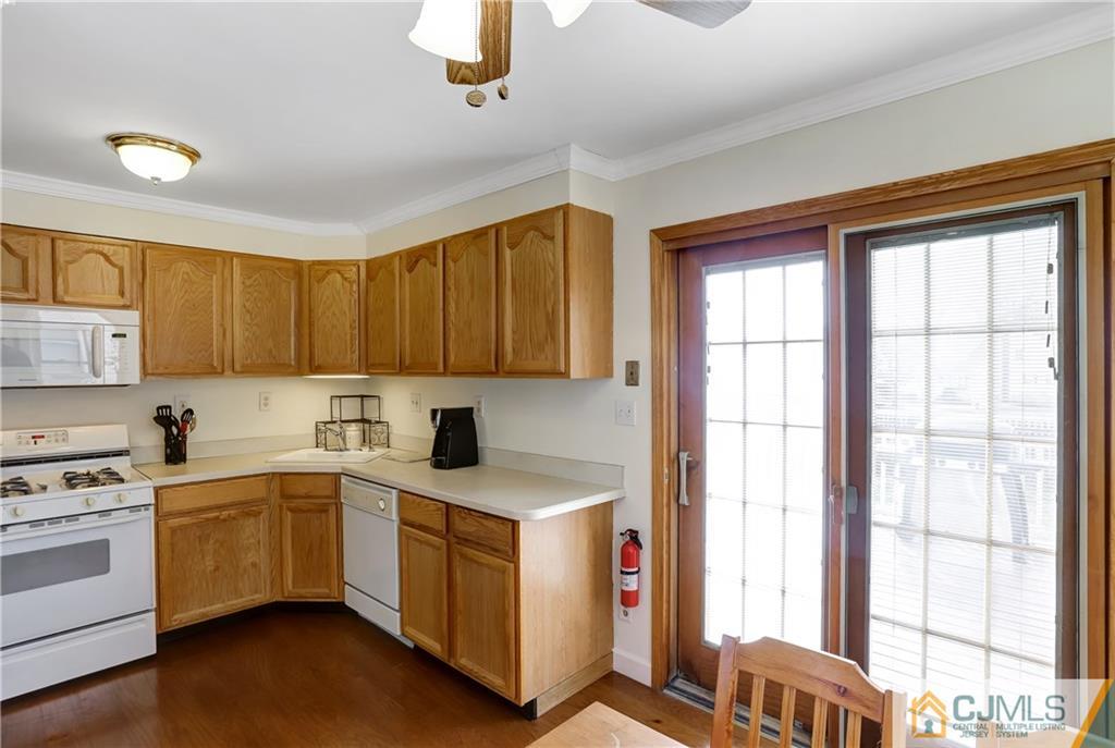 419 Crows Mill Road Fords, NJ 08863 - Photo 3 of 10 a kitchen with a stove a sink and cabinets
