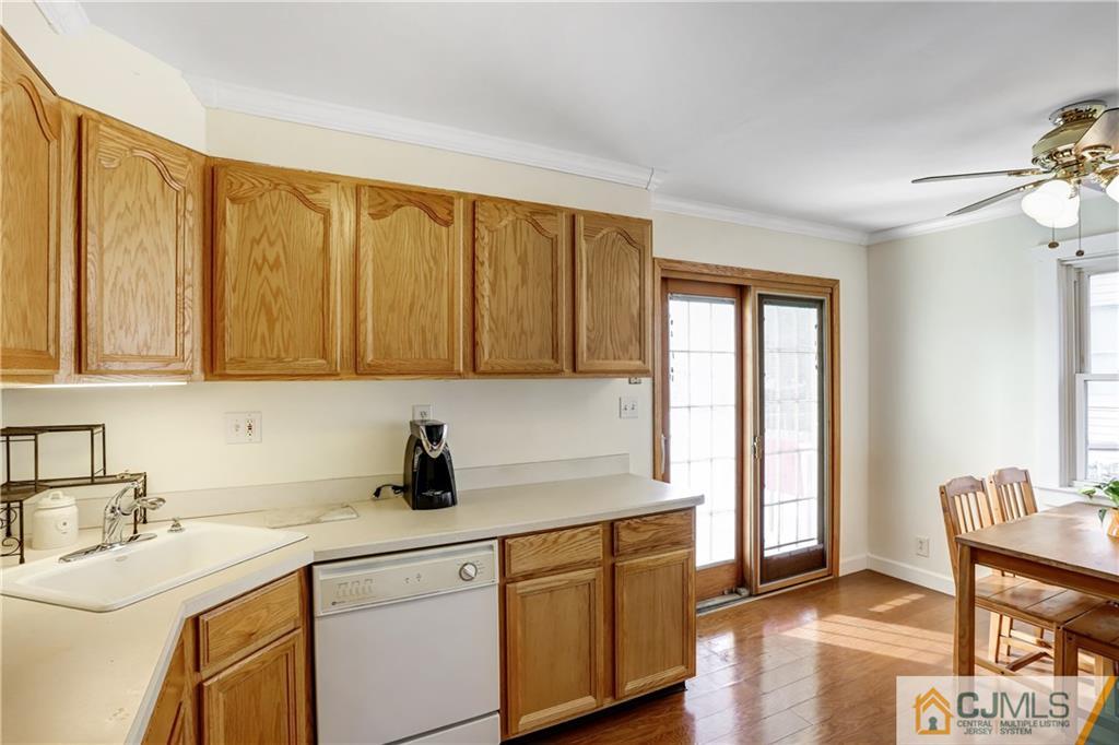 419 Crows Mill Road Fords, NJ 08863 - Photo 5 of 10 a kitchen with a sink cabinets and window