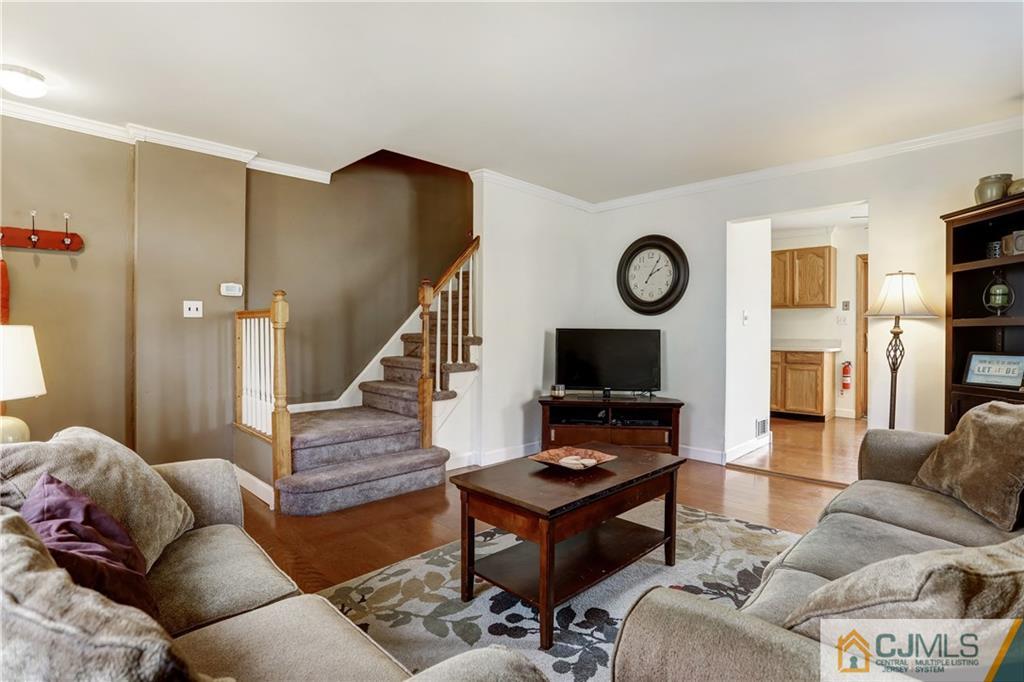 419 Crows Mill Road Fords, NJ 08863 - Photo 6 of 10 a living room with furniture and a flat screen tv