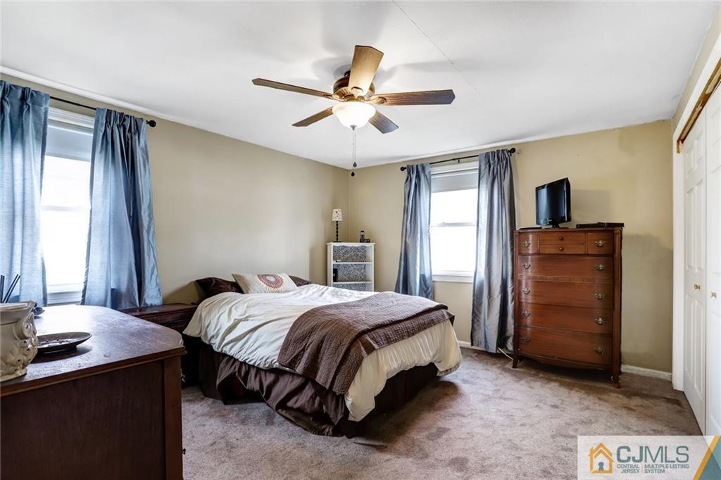 419 Crows Mill Road Fords, NJ 08863 - Photo 7 of 10 a bedroom with a bed and a dresser