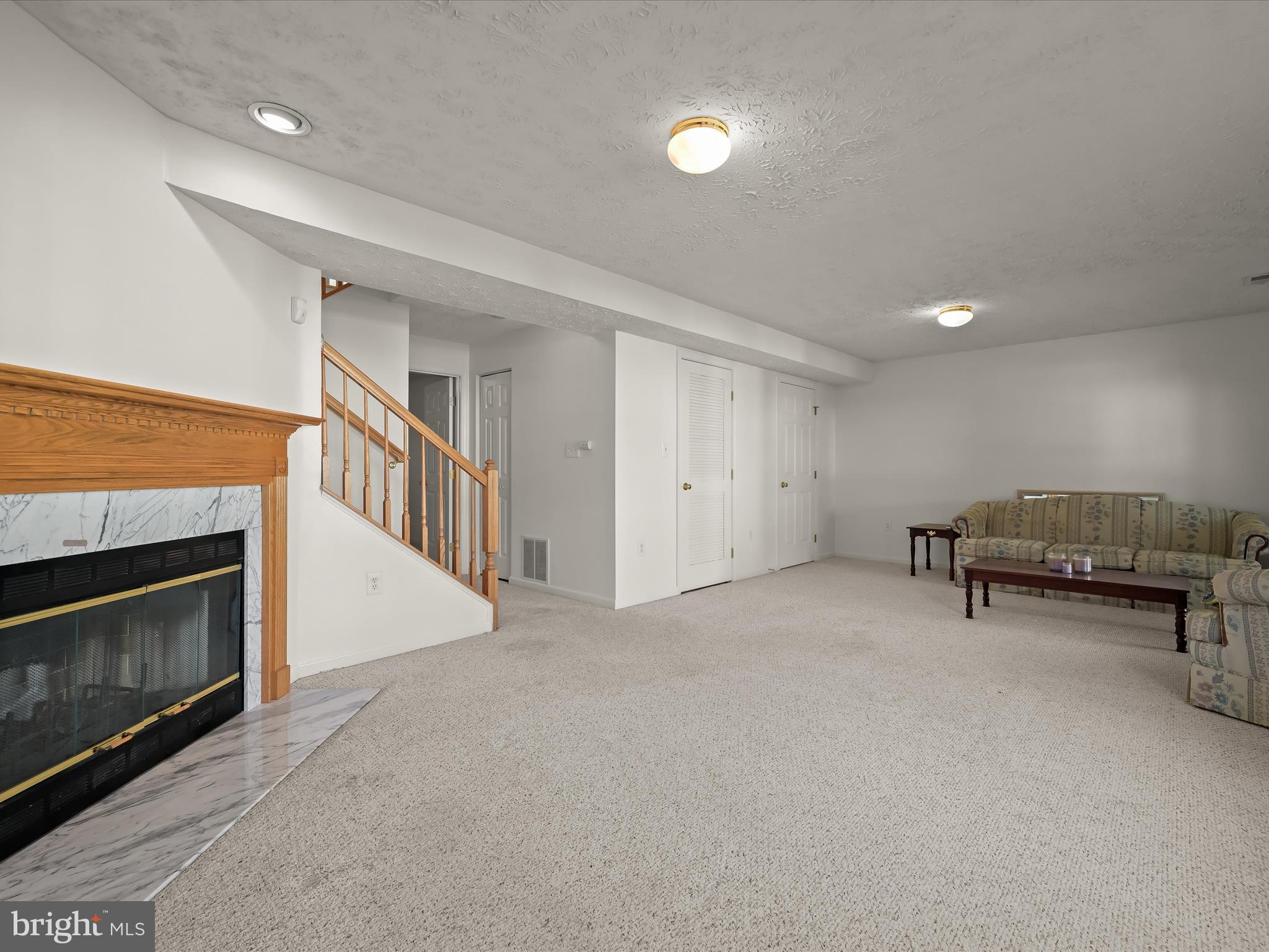 8238 Lyndhurst Street Laurel, MD 20724 - Photo 29 of 50 Lower level family room with WB fireplace