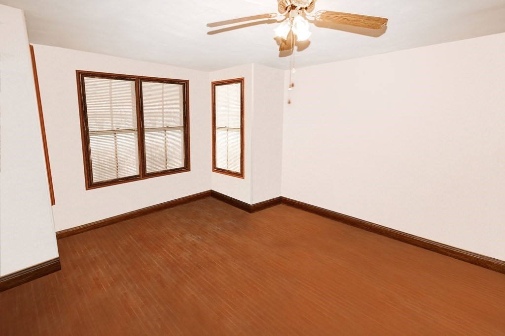 452 Gallivan Boulevard Boston, MA 02124 - Photo 14 of 24 an empty room with windows and fan