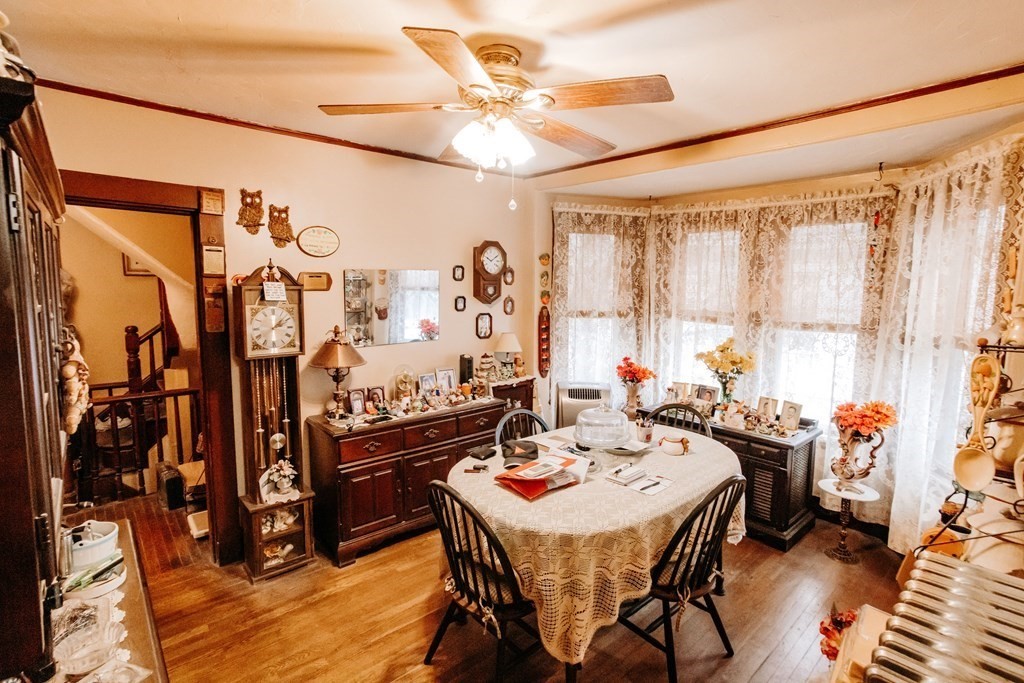 452 Gallivan Boulevard Boston, MA 02124 - Photo 8 of 24 a view of a dining room with furniture and chandelier