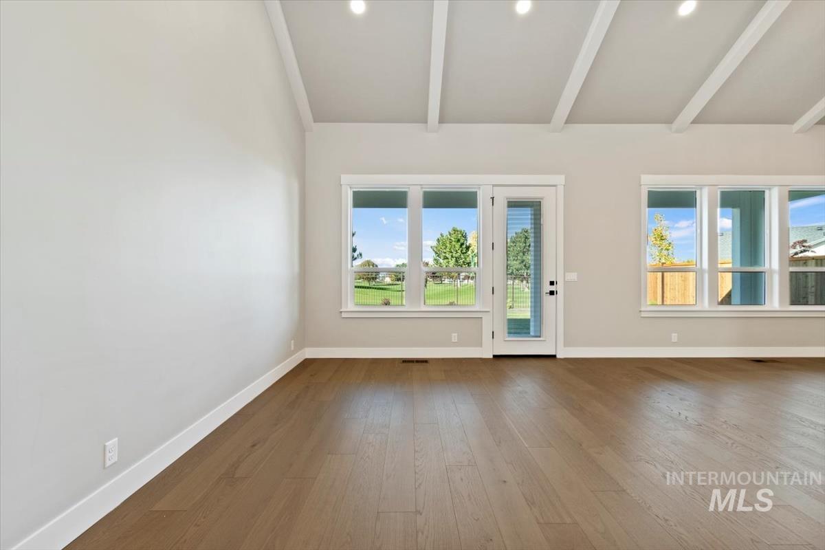 7353 Powell Place Eagle, ID 83714 - Photo 20 of 45 Spare room featuring baseboards and hardwood / wood-style flooring