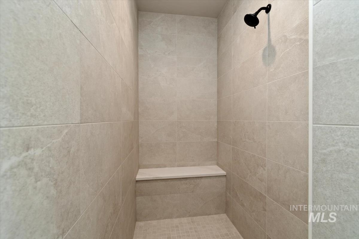 7353 Powell Place Eagle, ID 83714 - Photo 28 of 45 Bathroom featuring a tile shower