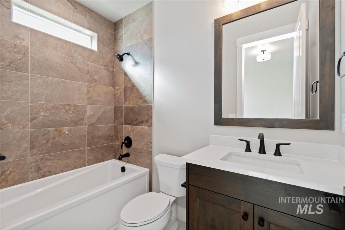 7353 Powell Place Eagle, ID 83714 - Photo 33 of 45 Full bathroom with vanity and bathing tub / shower combination