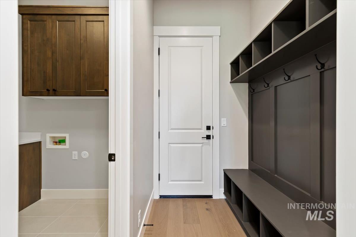 7353 Powell Place Eagle, ID 83714 - Photo 38 of 45 Mudroom featuring baseboards and light wood finished floors