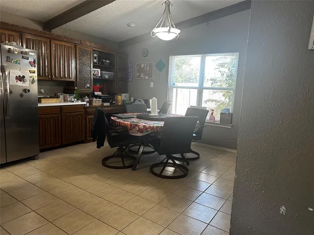a view of a kitchen and dining room
