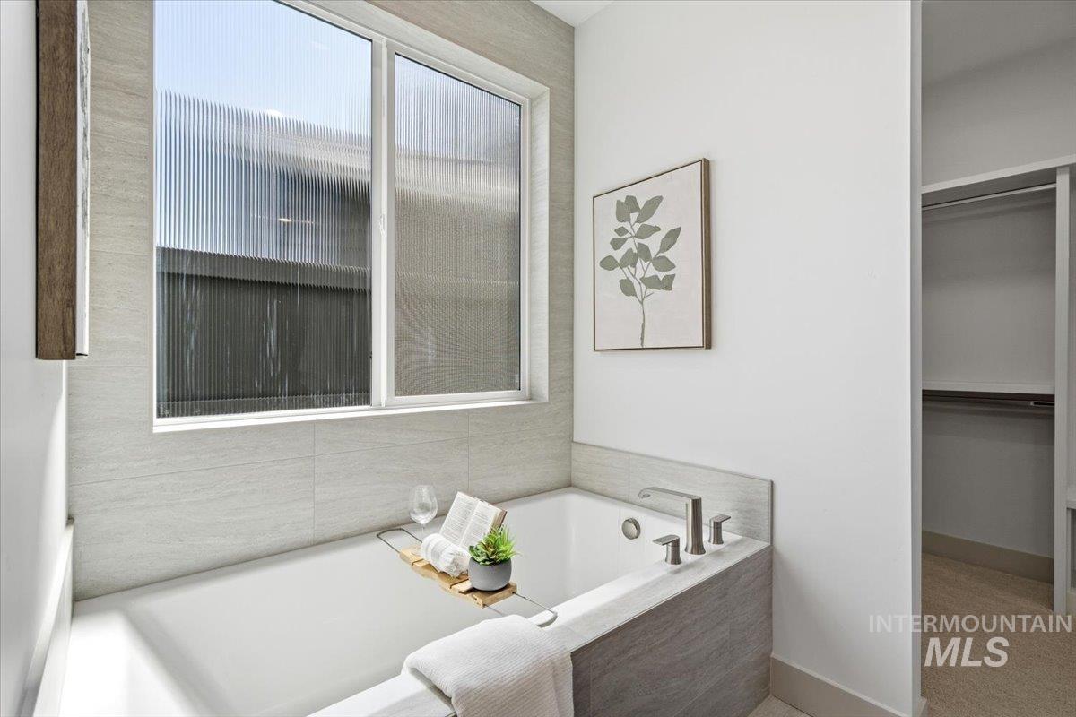 6762 South Messner Way Meridian, ID 83642 - Photo 18 of 35 Recessed soaking tub with deck-mounted brushed nickel fixtures