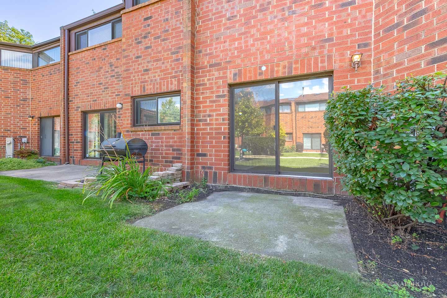 901 South Racine Avenue, Unit C Chicago, IL 60607 - Photo 14 of 39 a view of a brick house with a yard and plants
