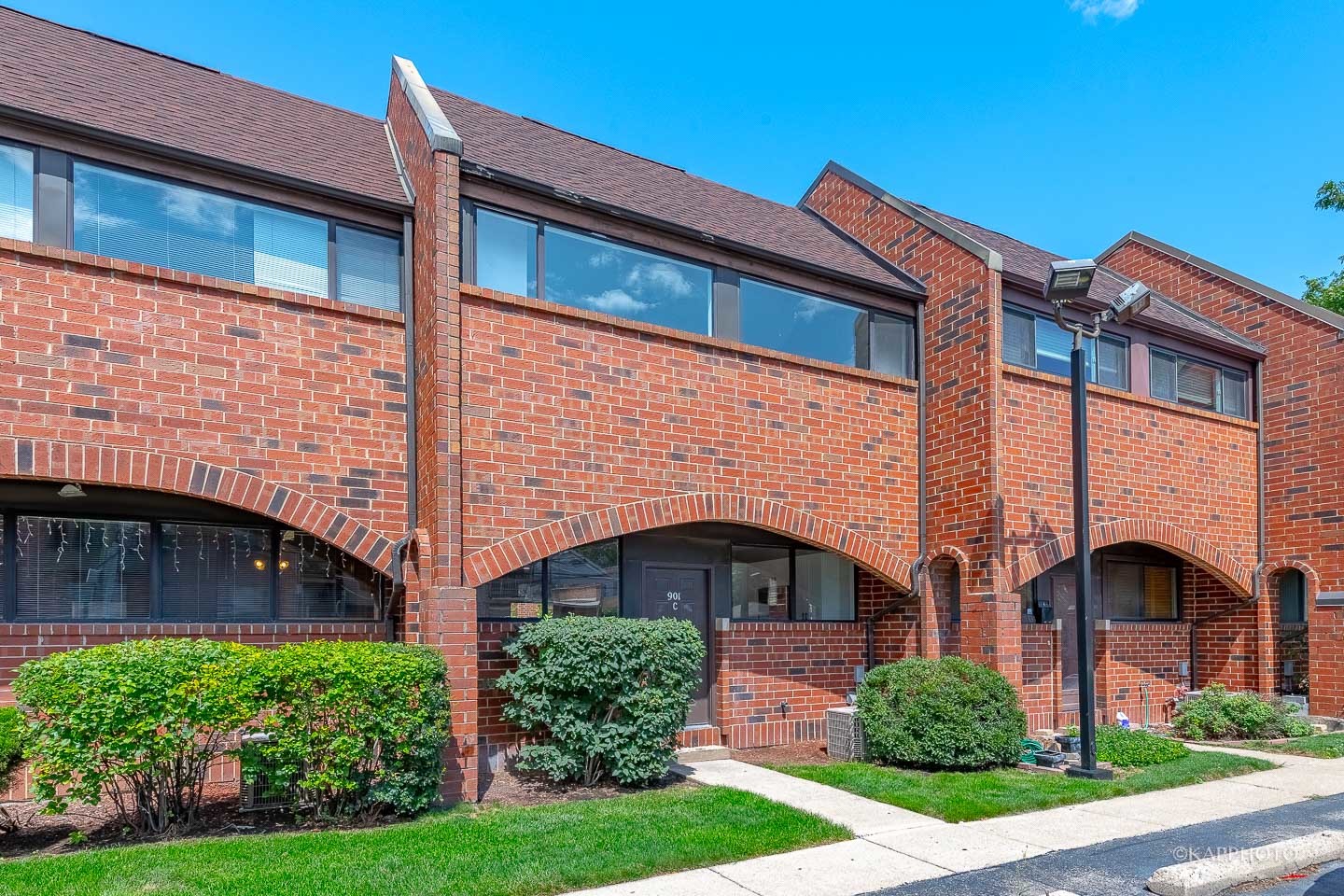 901 South Racine Avenue, Unit C Chicago, IL 60607 - Photo 2 of 39 a front view of a house with a yard and potted plants
