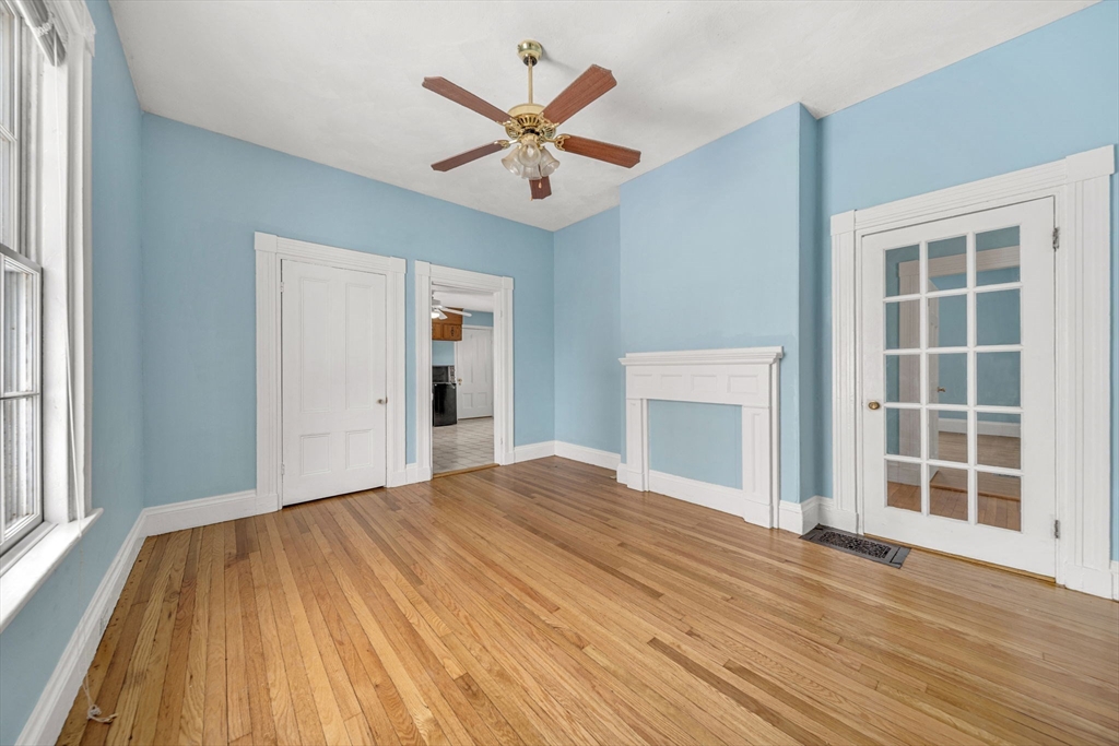 28 Linden Place Dedham, MA 02026 - Photo 15 of 42 a view of a livingroom with wooden floor and a ceiling fan