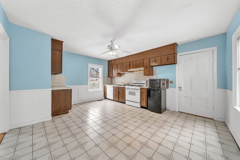 28 Linden Place Dedham, MA 02026 - Photo 16 of 42 a kitchen with a sink a counter top space and appliances