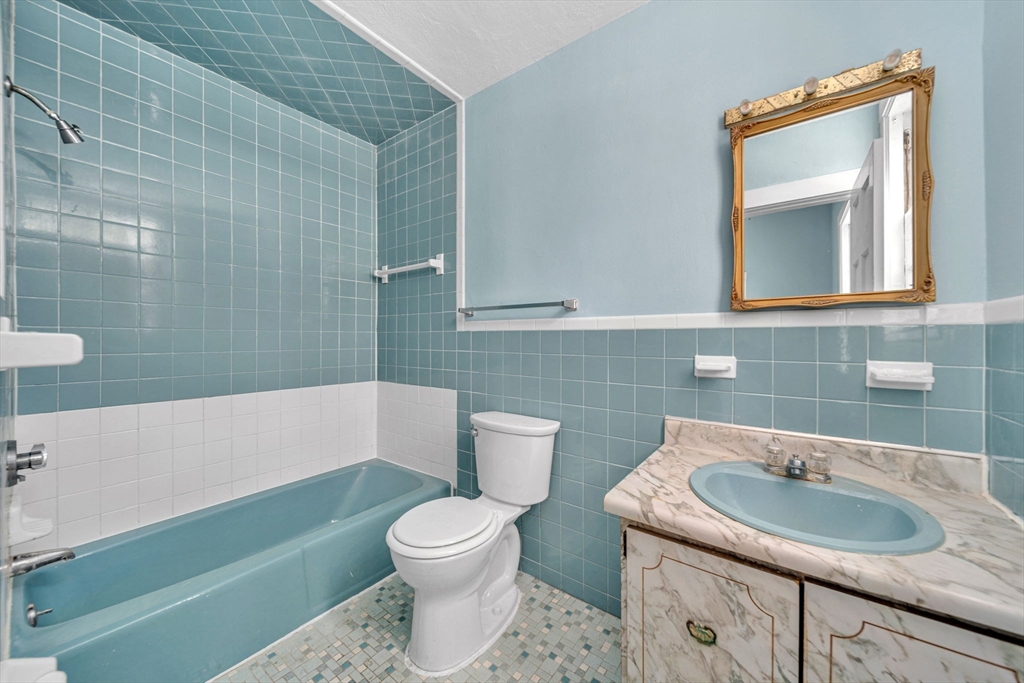 28 Linden Place Dedham, MA 02026 - Photo 24 of 42 a bathroom with a sink and a toilet