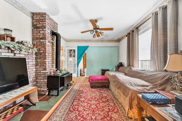 a bedroom with a bed and flat screen tv