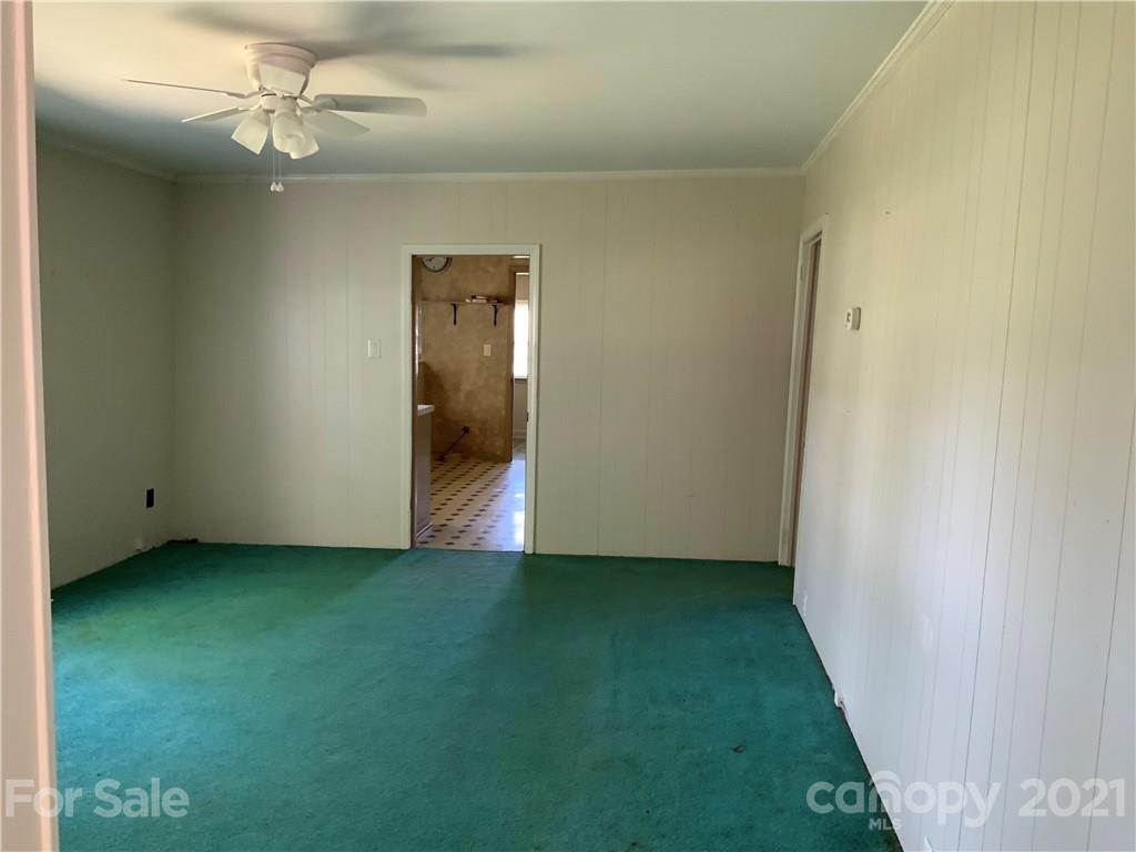 2149 Smithford Road Hickory Grove, SC 29717 - Photo 11 of 16 an empty room with a ceiling fan and bathroom