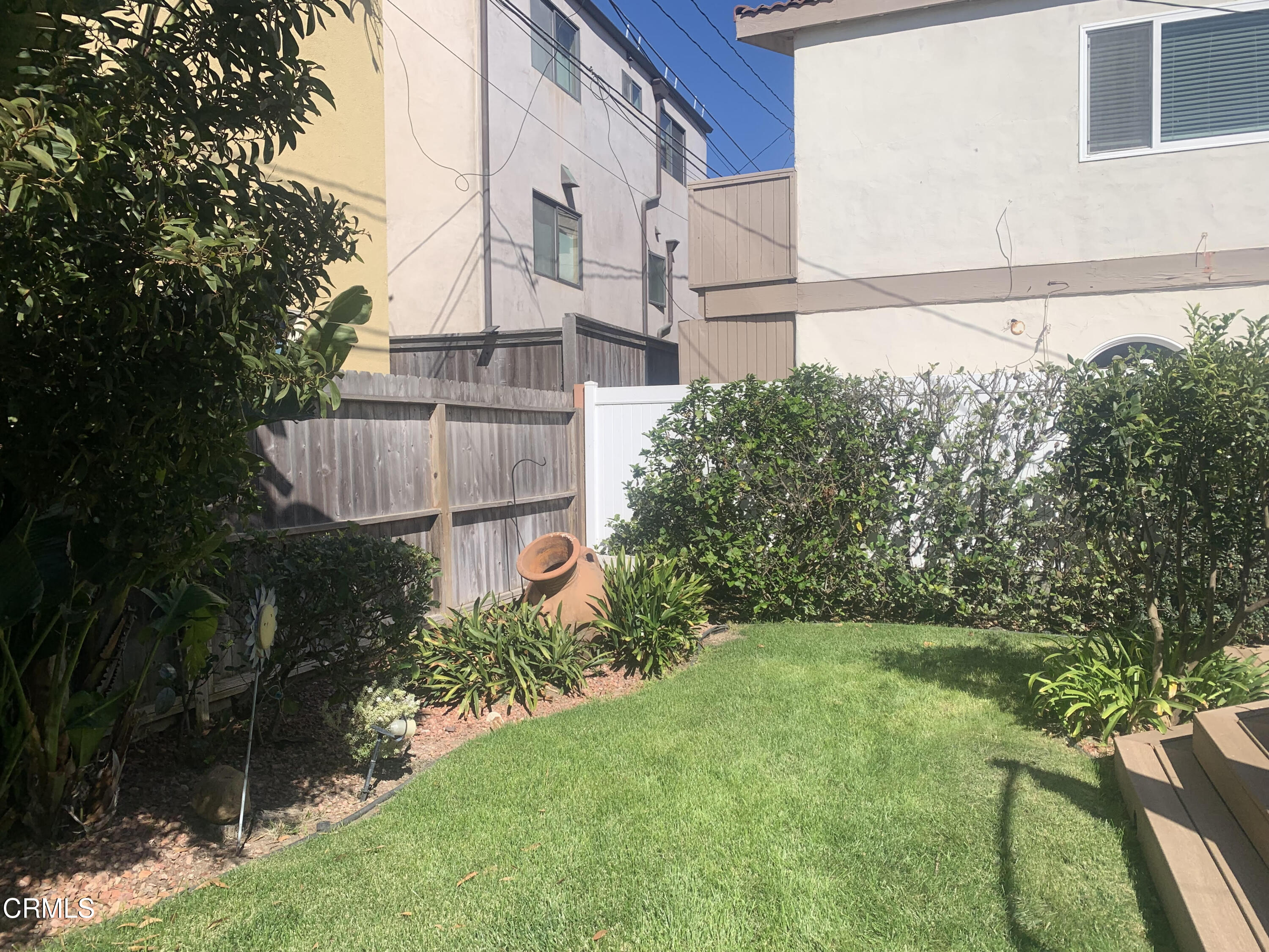 141 Burbank Avenue Oxnard, CA 93035 - Photo 6 of 8 a view of a house with a yard and plants
