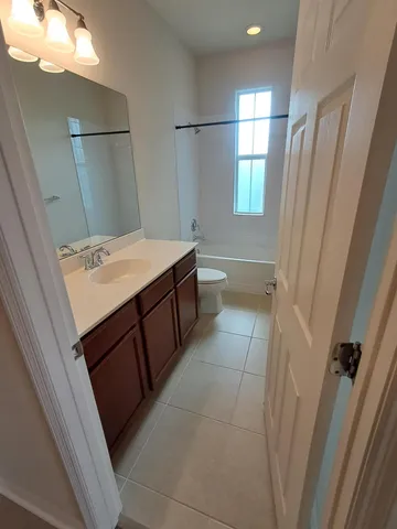 a bathroom with a sink a vanity and a mirror