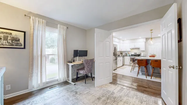 a view of a living room kitchen and a window