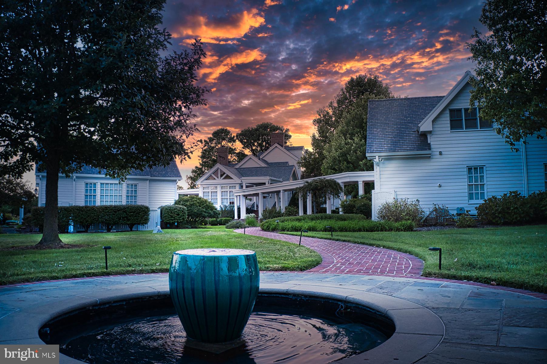 5289 Ferry Neck Road Royal Oak, MD 21662 - Photo 14 of 80 a view of a chairs and table in backyard of the house