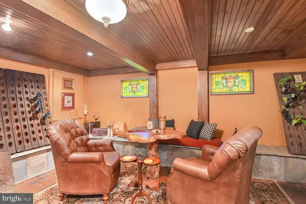 a living room with lots of furniture and a flat screen tv