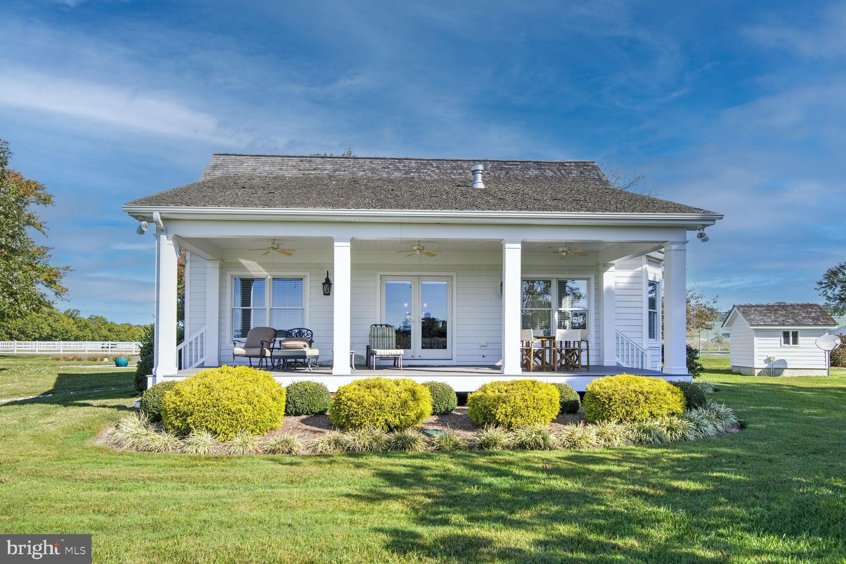 5289 Ferry Neck Road Royal Oak, MD 21662 - Photo 39 of 80 a view of a house with swimming pool and sitting area