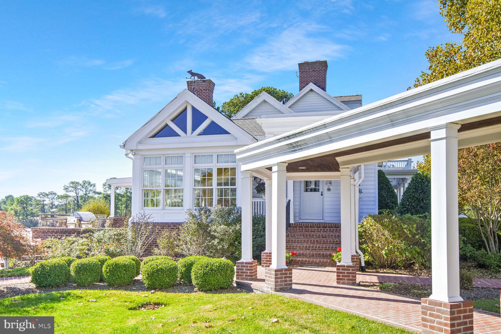 5289 Ferry Neck Road Royal Oak, MD 21662 - Photo 49 of 80 a front view of a house with garden
