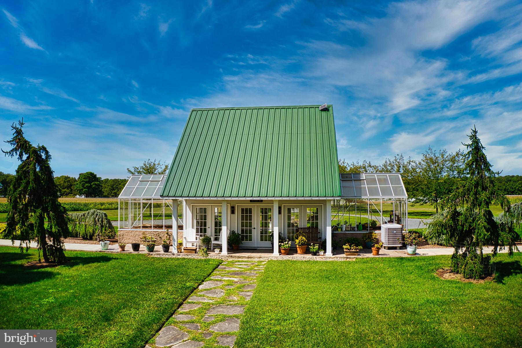 5289 Ferry Neck Road Royal Oak, MD 21662 - Photo 74 of 80 a front view of a house with a garden